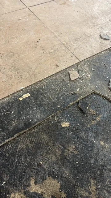 Black bitumen mastic floor removal in a SW3 flat
